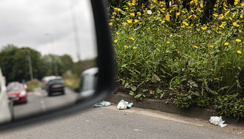 Fast-food packaging littered on a road