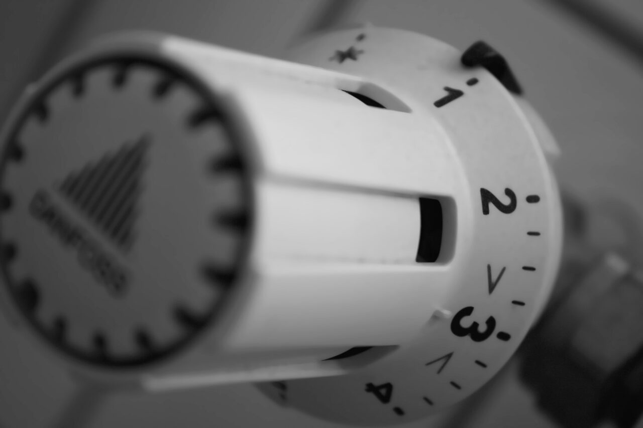 Close-up of a white radiator dial.