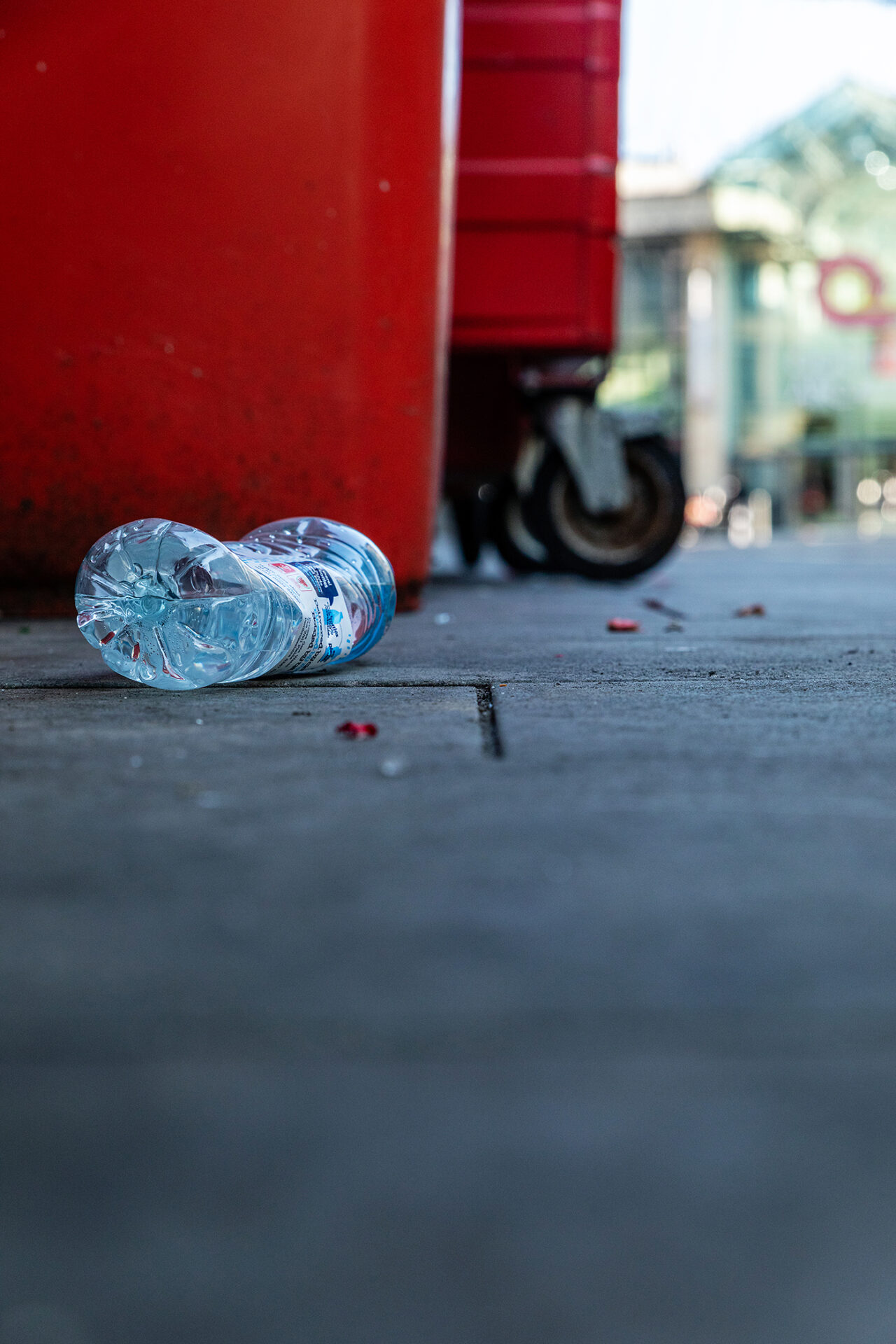 Plastic bottle on pavement