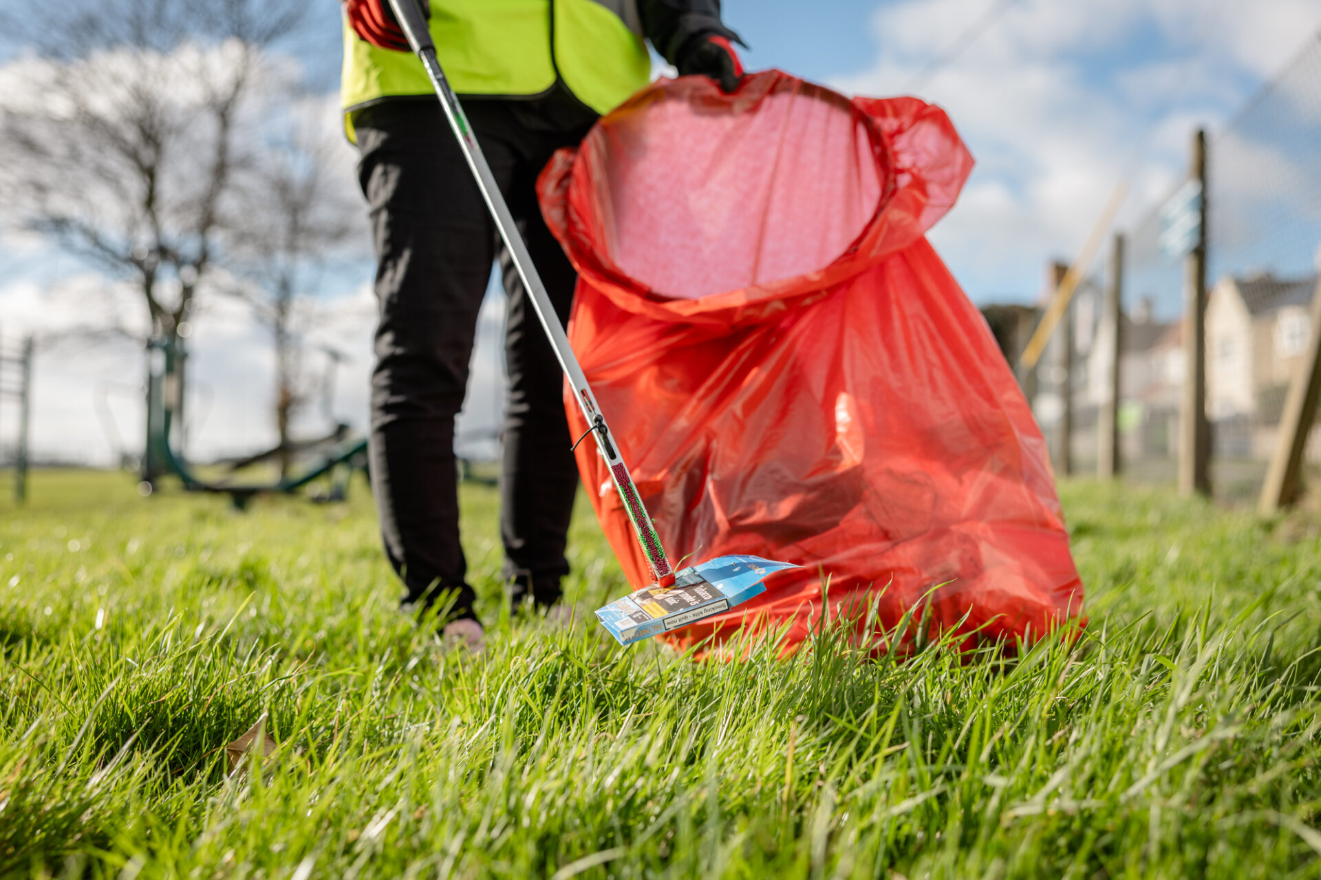 Keep Wales Tidy staff member picking up litter