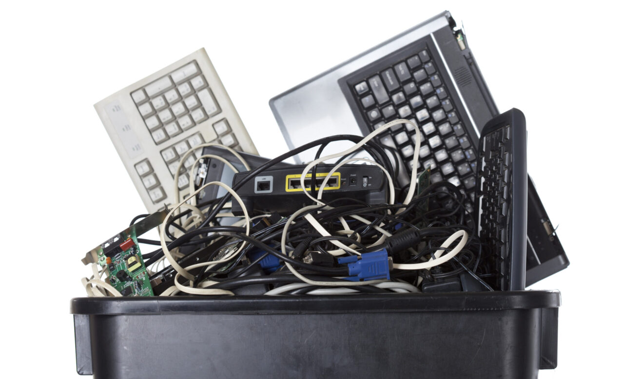 Electrical recycling box full of old computer items for recycling or reuse